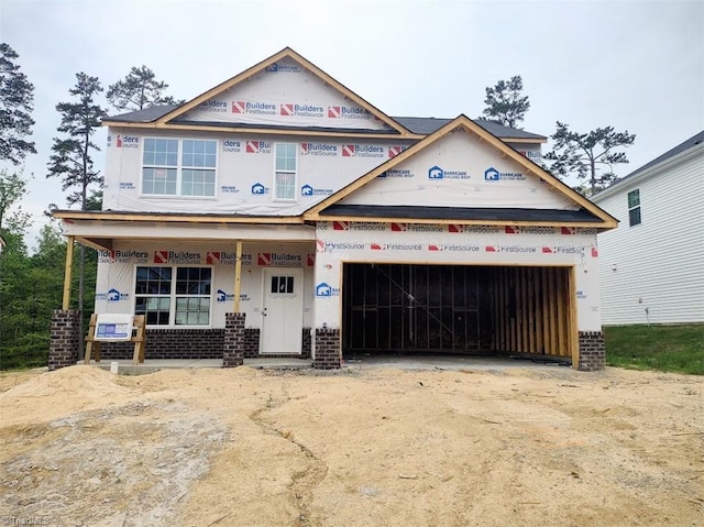 4099 Stallion St Lot 18, High Point, NC 27262 - property under construction with brick siding, driveway, a garage, and a porch