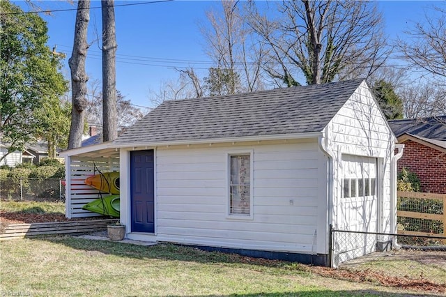 view of outbuilding featuring a yard and a garage