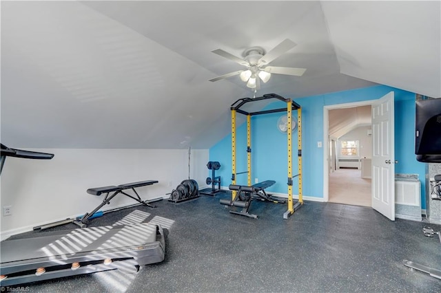 workout area with ceiling fan and vaulted ceiling