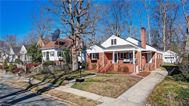 view of front of home featuring a front lawn and covered porch