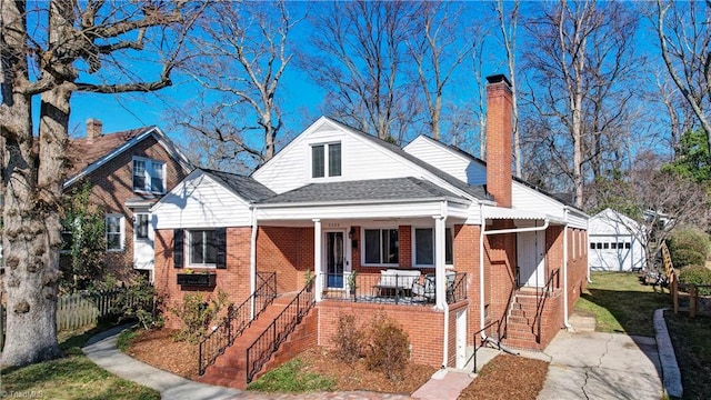 bungalow featuring a porch and a garage