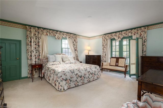 bedroom featuring light carpet