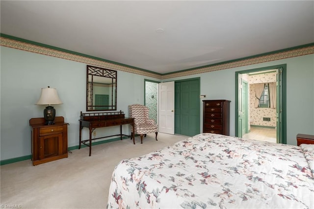 bedroom with light carpet, ensuite bath, and a closet