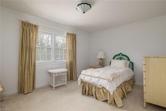 bedroom with ornamental molding and light carpet