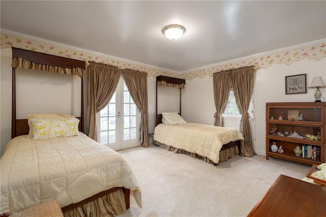 bedroom with ornamental molding, light carpet, and french doors