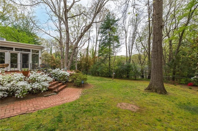 view of yard with a sunroom