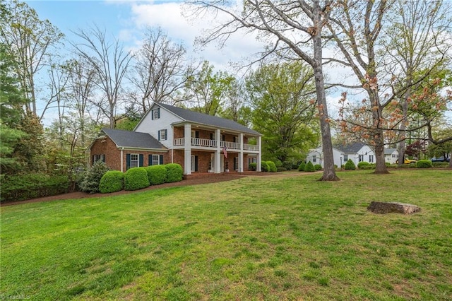 back of house with a lawn