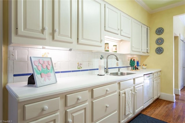 kitchen with dishwasher, backsplash, sink, ornamental molding, and wood-type flooring