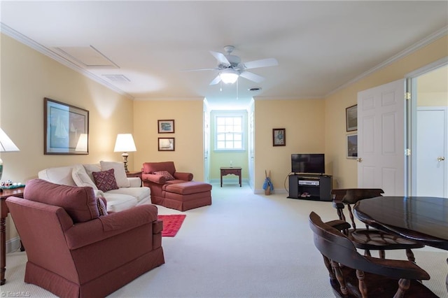 carpeted living room with ceiling fan and ornamental molding