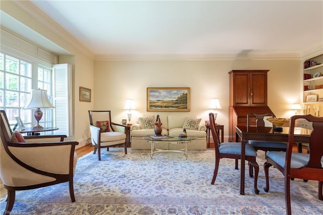 living area with ornamental molding and light wood-type flooring