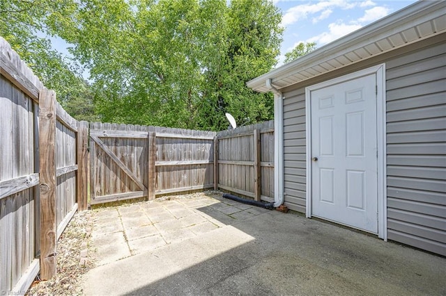 view of patio with a fenced backyard and a gate