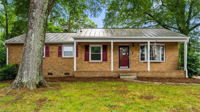 1605 Guyer St, High Point, NC 27265 - ranch-style home featuring a front yard, a standing seam roof, brick siding, and metal roof