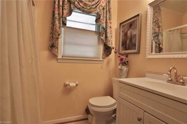 bathroom featuring vanity and toilet