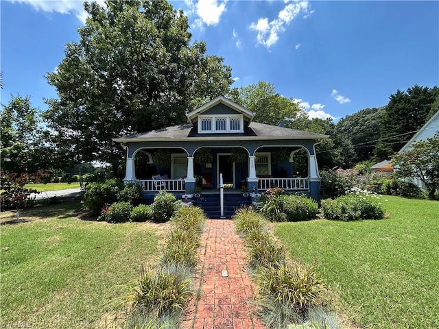 330 Alamance St, Gibsonville, NC 27249 - view of front facade featuring a porch and a front lawn