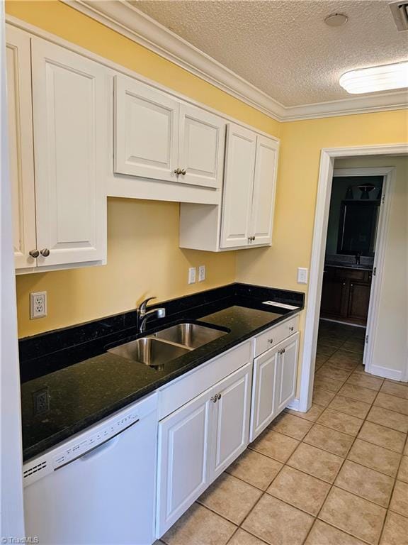 kitchen featuring white cabinets, dishwasher, ornamental molding, a sink, and light tile patterned flooring