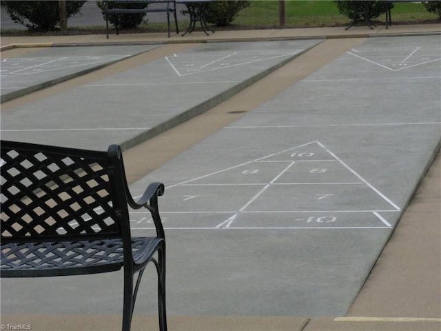 view of home's community featuring shuffleboard