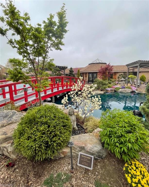 exterior space featuring a pergola and a pool