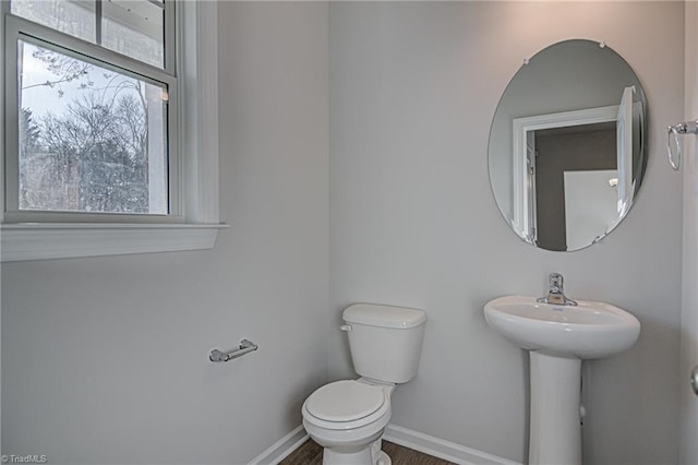 bathroom featuring toilet and a healthy amount of sunlight