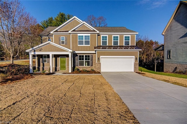 view of front of home with a porch and a garage