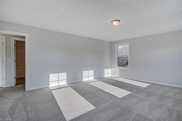 unfurnished room featuring carpet