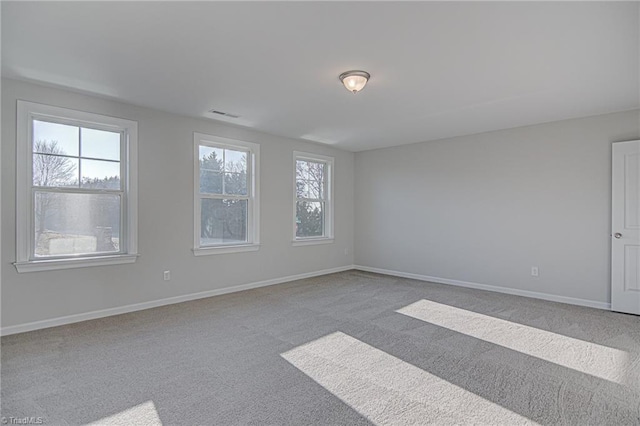 unfurnished room featuring carpet flooring