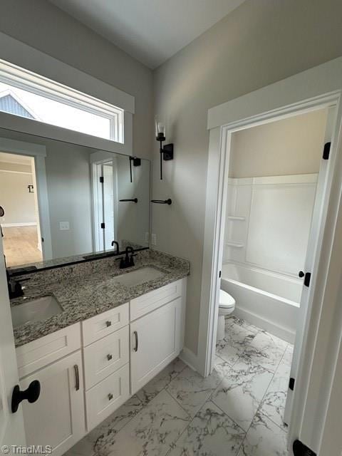 full bathroom with shower / bathing tub combination, vanity, and toilet