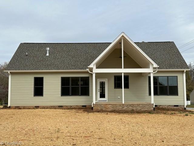 rear view of property with covered porch