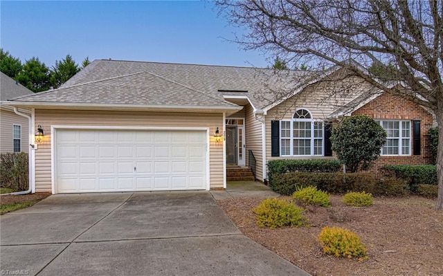 ranch-style home featuring a garage