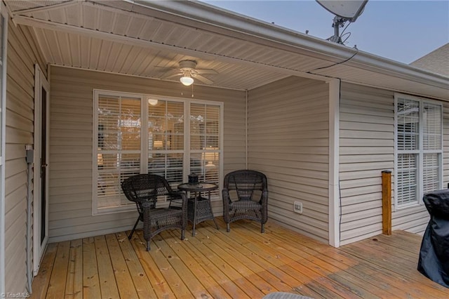 wooden terrace featuring ceiling fan