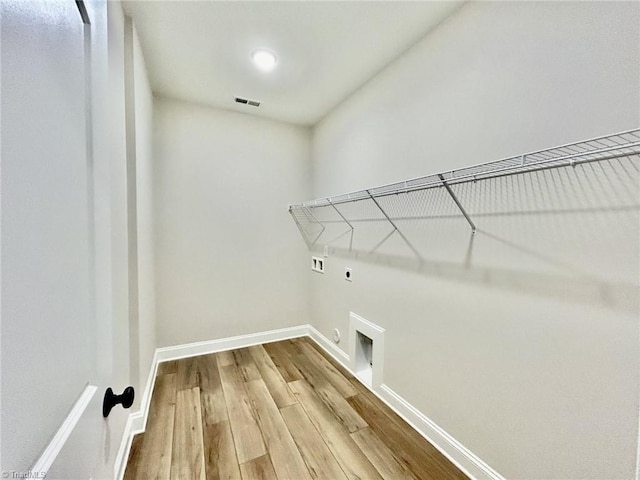 laundry area featuring washer hookup, hookup for an electric dryer, and light wood-type flooring