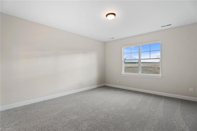 empty room featuring carpet floors