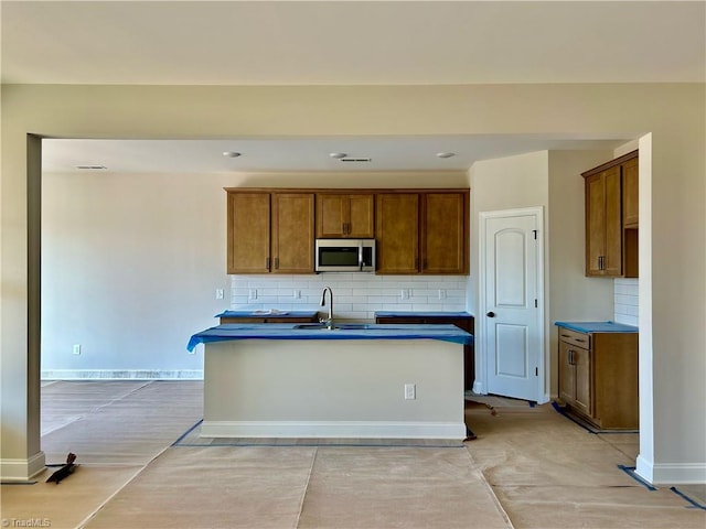 kitchen featuring sink and decorative backsplash