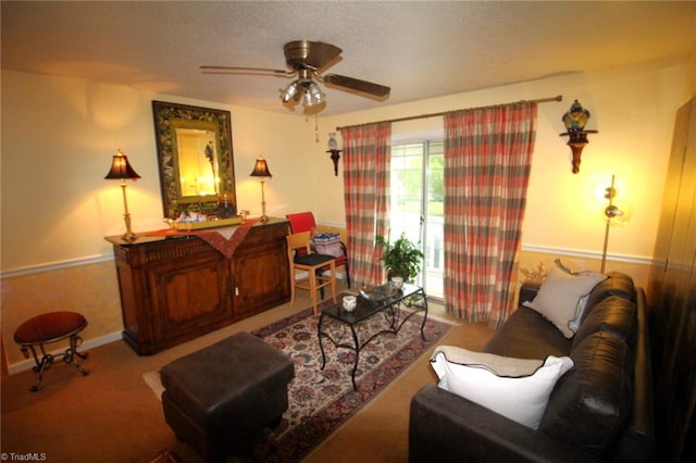 living room featuring carpet flooring and ceiling fan