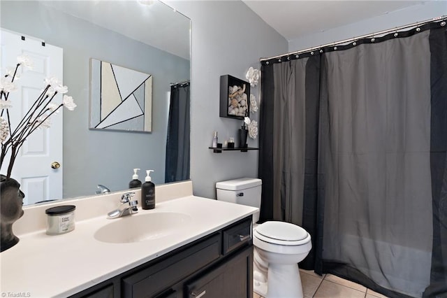 full bath featuring a shower with shower curtain, toilet, vanity, and tile patterned flooring