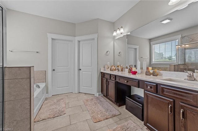 8018 Hacker Dr, Stokesdale, NC 27327 - bathroom featuring double vanity, a bath, a tile shower, and tile patterned floors