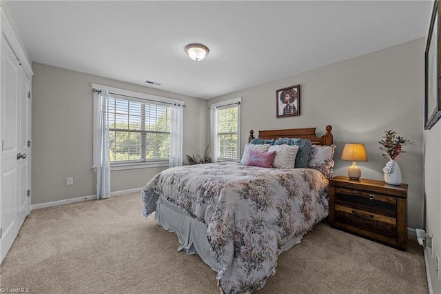 8018 Hacker Dr, Stokesdale, NC 27327 - bedroom featuring light colored carpet and baseboards