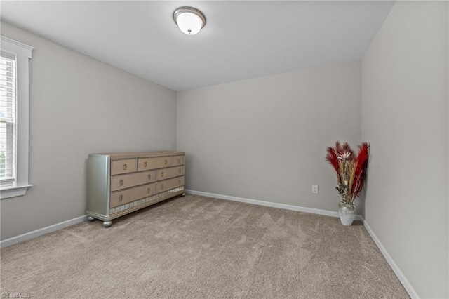 8018 Hacker Dr, Stokesdale, NC 27327 - unfurnished bedroom with carpet flooring and baseboards
