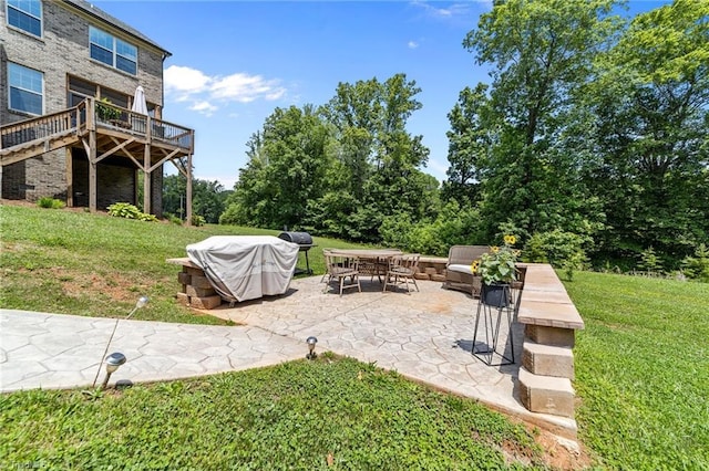 8018 Hacker Dr, Stokesdale, NC 27327 - view of grassy yard featuring a patio and a deck