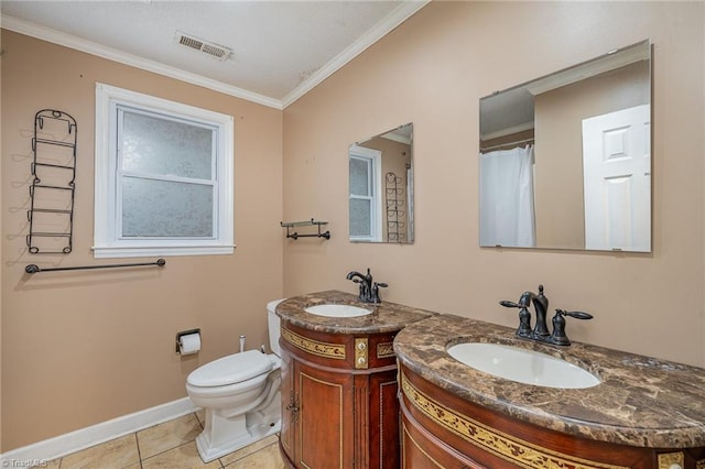 bathroom featuring toilet, vanity, tile patterned floors, and crown molding