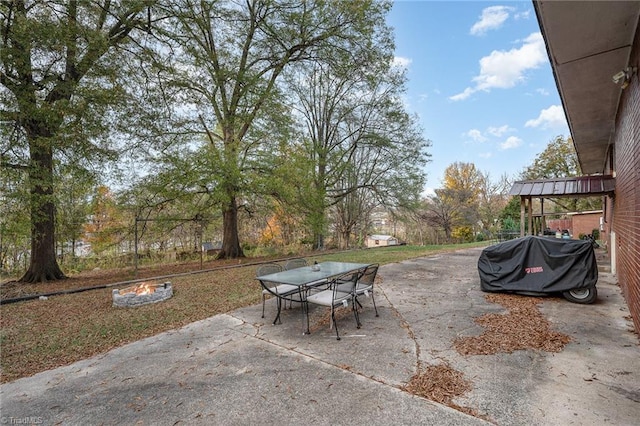 view of patio / terrace with area for grilling and an outdoor fire pit