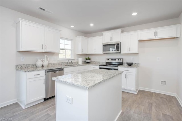 248 Warbler Way, Lexington, NC 27295 - kitchen featuring stainless steel appliances, a sink, white cabinets, and recessed lighting