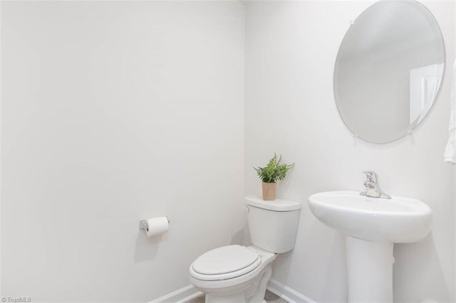 248 Warbler Way, Lexington, NC 27295 - half bathroom with baseboards, toilet, and a sink