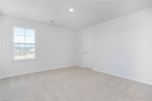 248 Warbler Way, Lexington, NC 27295 - unfurnished room featuring baseboards, light colored carpet, healthy amount of natural light, and recessed lighting