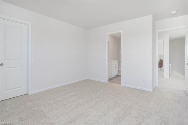 248 Warbler Way, Lexington, NC 27295 - unfurnished bedroom featuring light colored carpet, baseboards, and connected bathroom