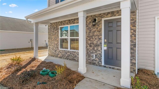 248 Warbler Way, Lexington, NC 27295 - view of exterior entry with covered porch and stone siding