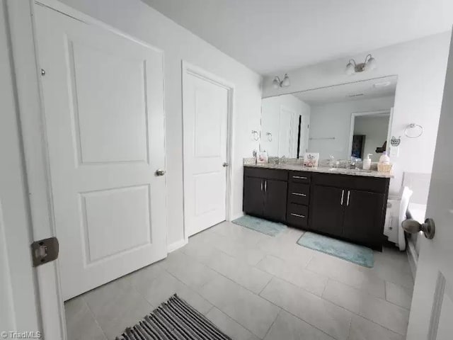 bathroom with vanity and tile patterned floors