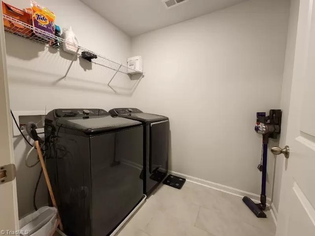 laundry area featuring washing machine and dryer