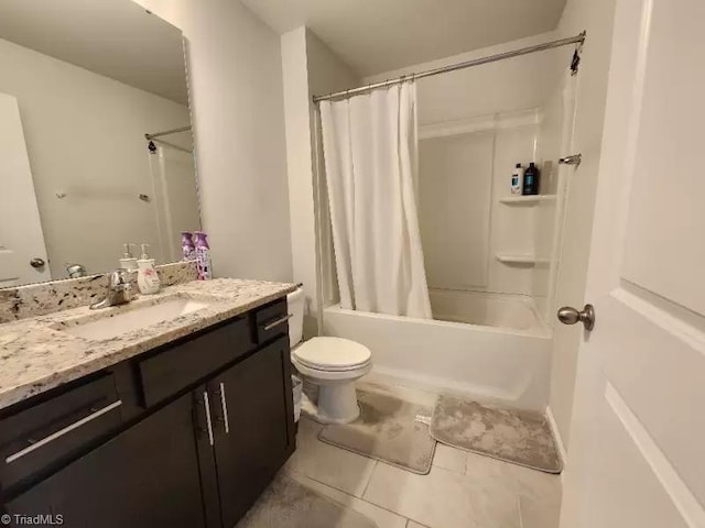 full bathroom featuring vanity, shower / bathtub combination with curtain, tile patterned floors, and toilet