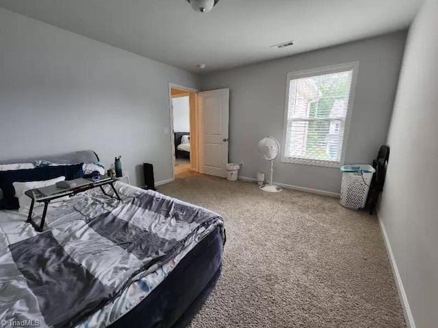 bedroom featuring carpet