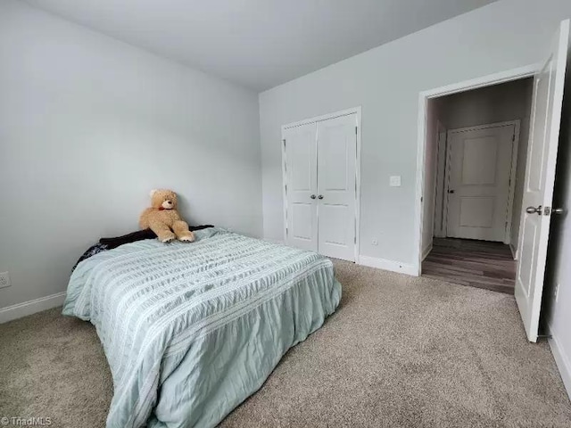 carpeted bedroom featuring a closet